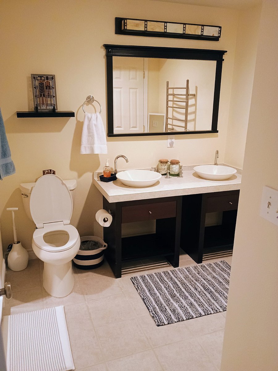 Bathroom with heated towel bar. Towels and washcloths are included along with a few bathroom basics. There is a hamper for clothes and a stand-up mirror that can be taken to wherever the guest wants to use it.