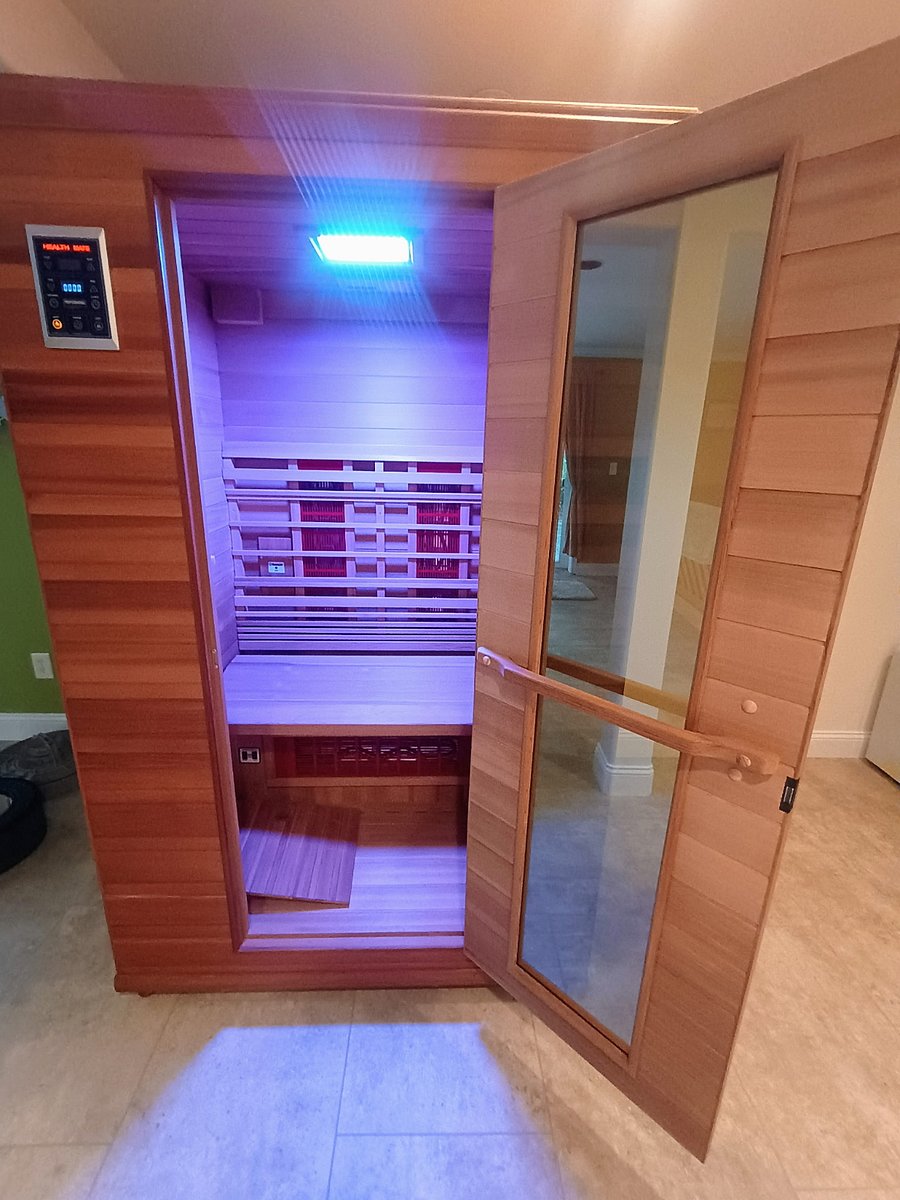 Sauna has ambient color and is fully customizable for time and heat. It takes about 15 minutes to get to 100 degrees and it has a timer as well. It can seat two people and when inside, you are able to see out clearly.
