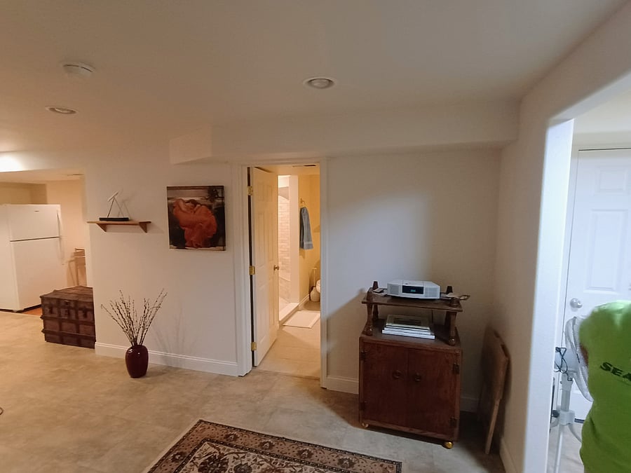 View from bedroom door towards bathroom and kitchen