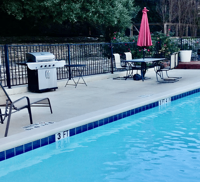 A pool and gas grill are only yards away from the front door.