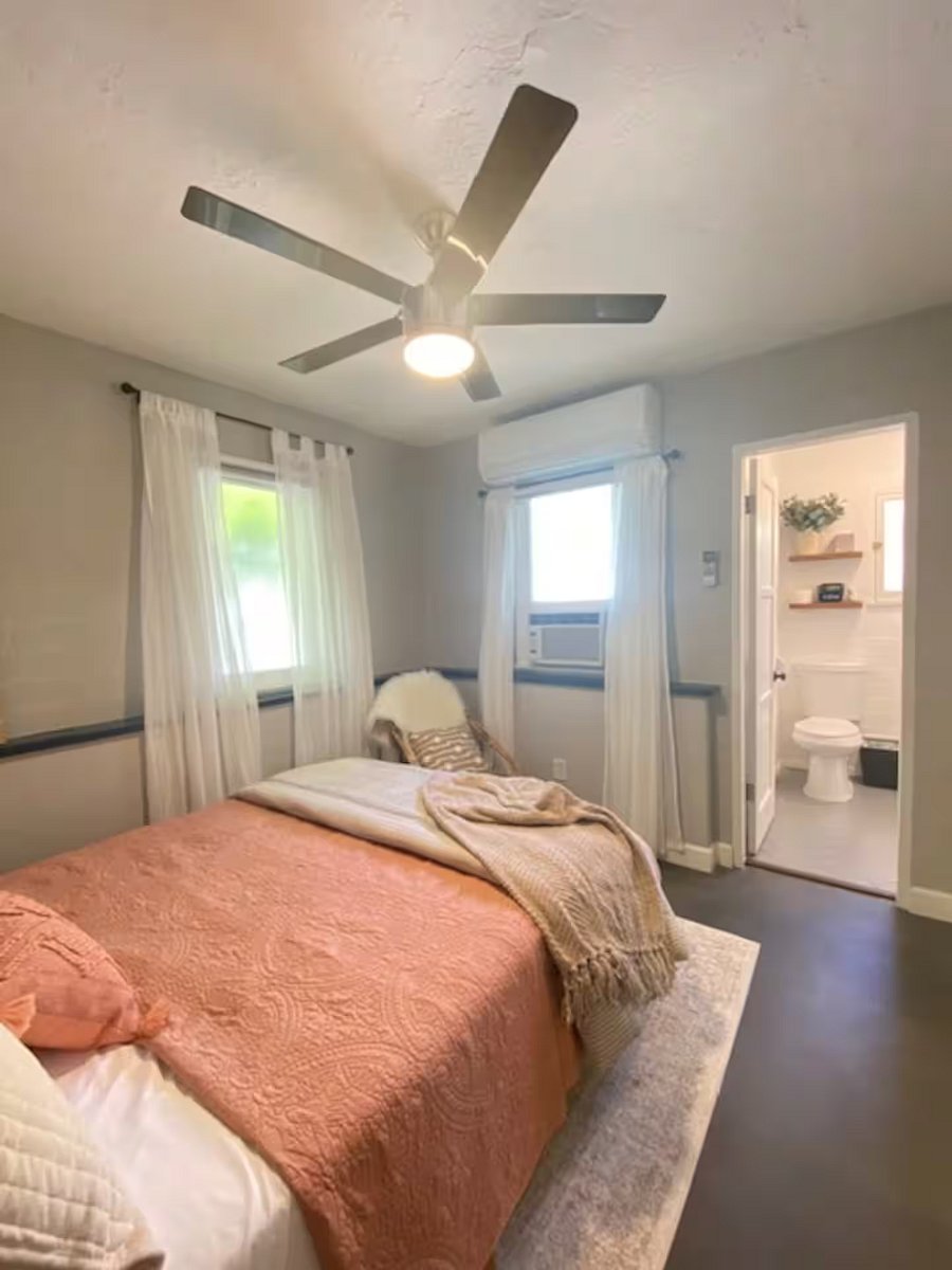Dreamy bedroom hideaway with light filtering shades.