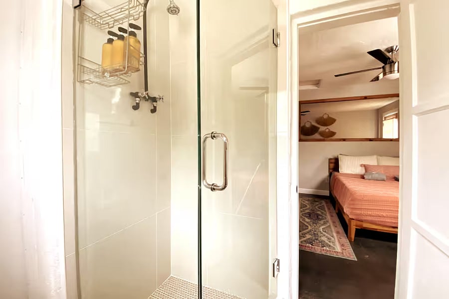 Bathroom is adjacent to bedroom.