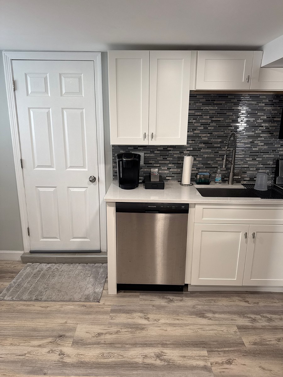Dishwasher, coffee station and sink.
Door goes to laundry area and upstairs (where we live).