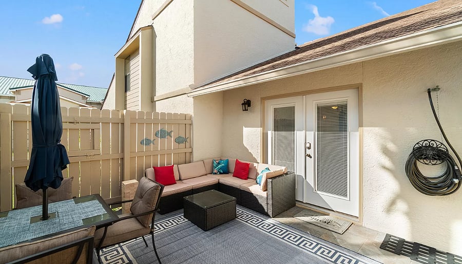 Here is the outdoor patio with seating area and table so you can enjoy the sunshine. 