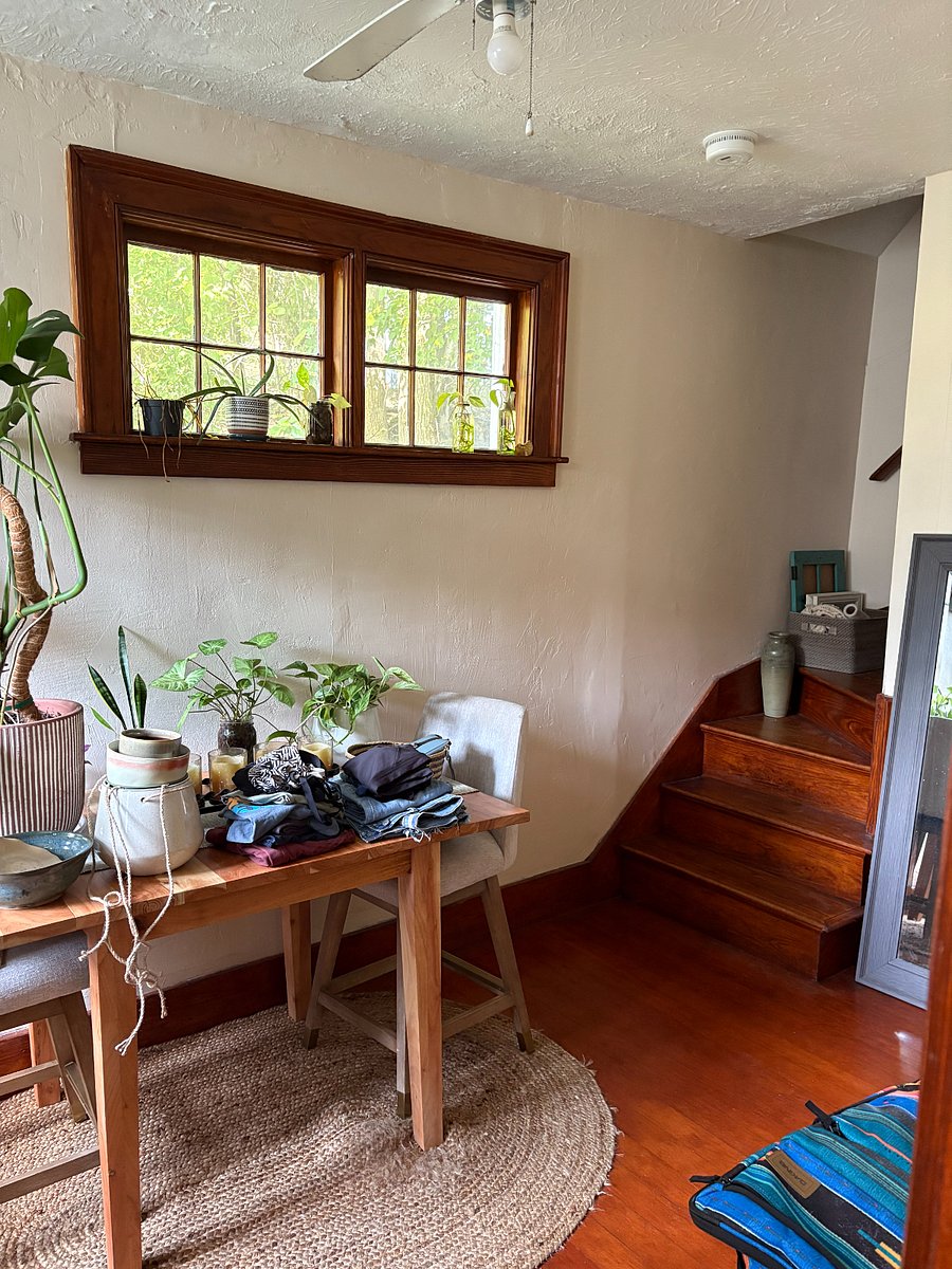Dining area with staircase to bedroom.