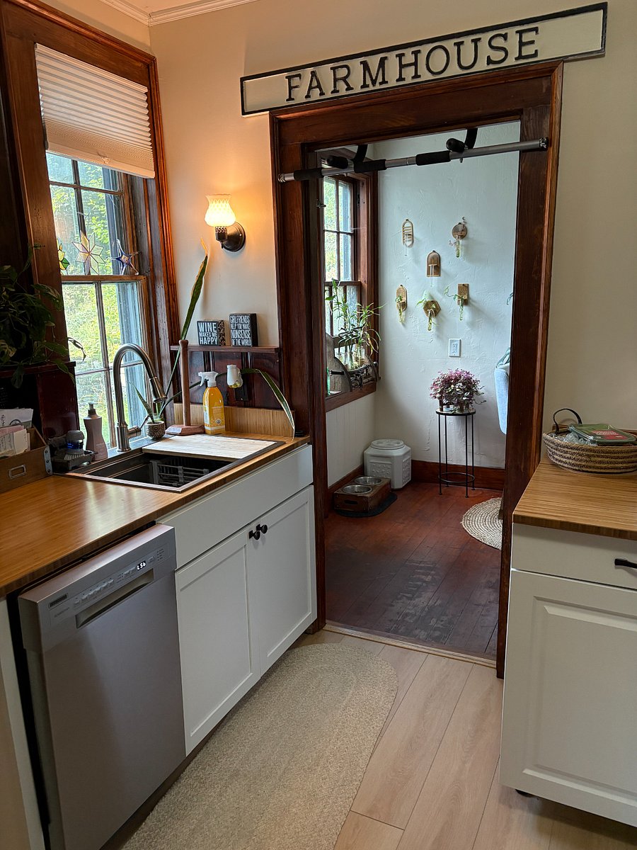 Kitchen leads into dining area with lots of natural light.  Door to private backyard and staircase to bedroom.