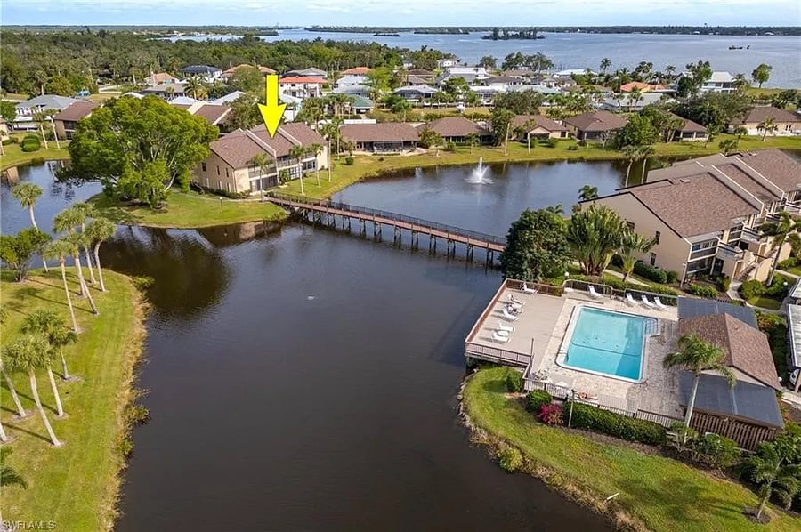 Footbridge behind the condo leads right to the swimming pool