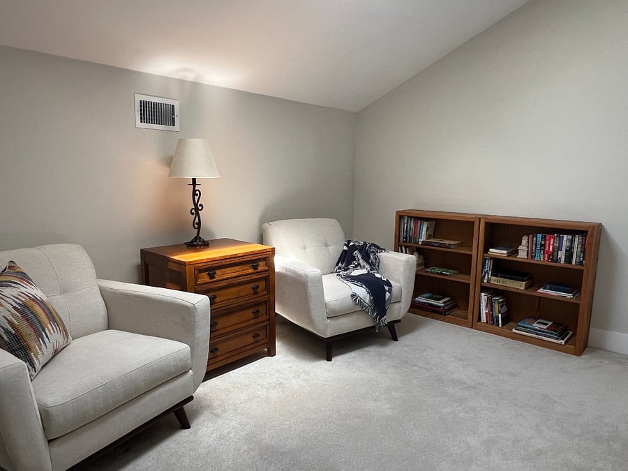 The loft is flooded with natural light from the skylight above, features new seating, books to read, and a Clavinova.