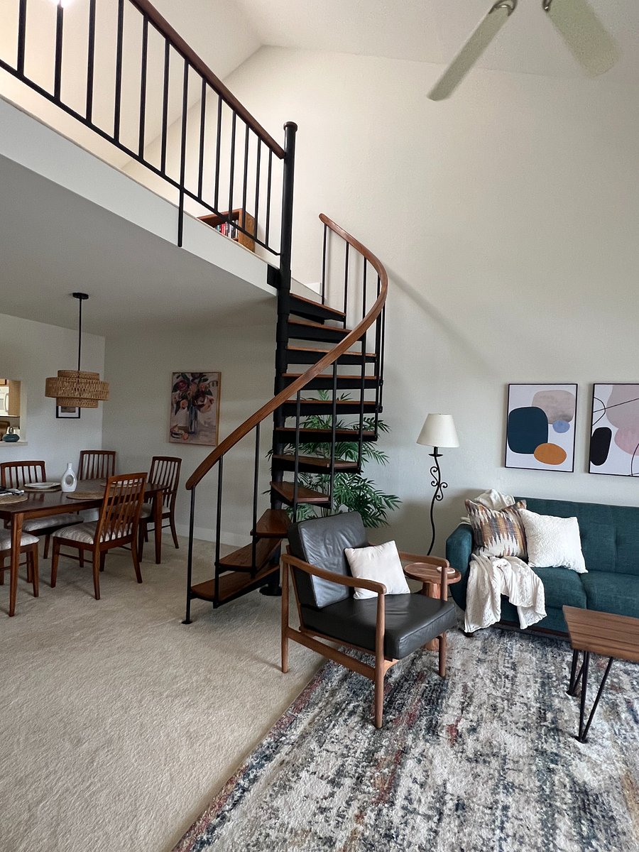 Spiral stairs to the loft where you'll find comfy chairs, books to read, and a Clavinova!
