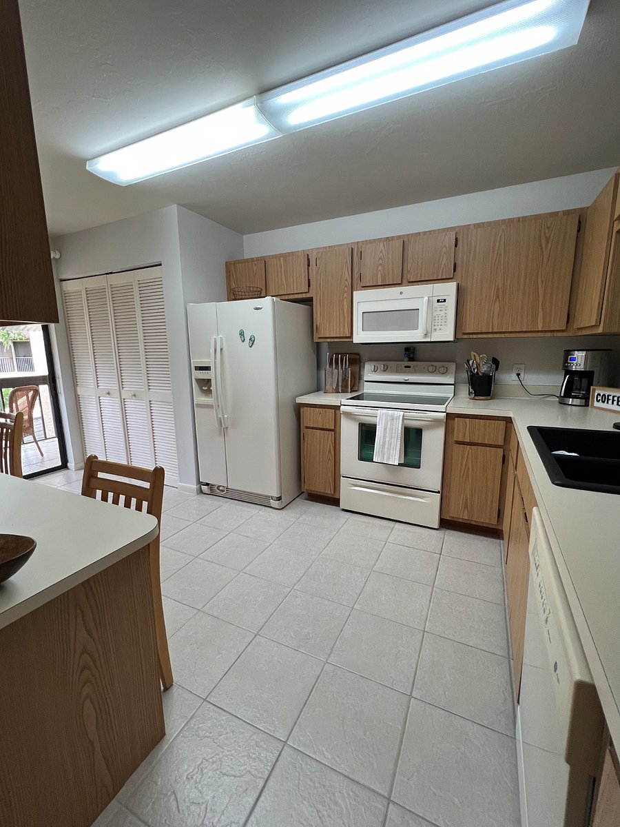 The laundry closet is conveniently located inside the condo
