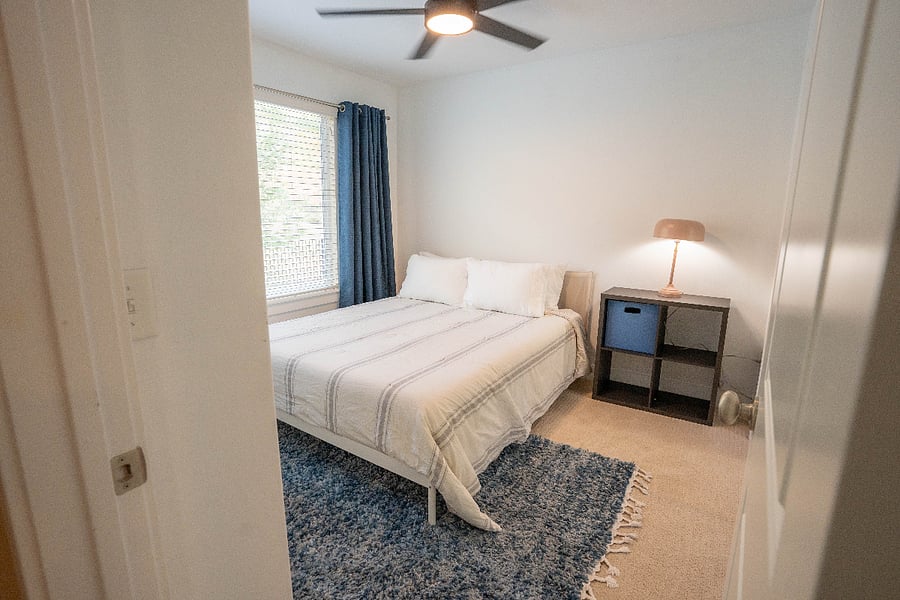 bedroom with queen bed and large closet