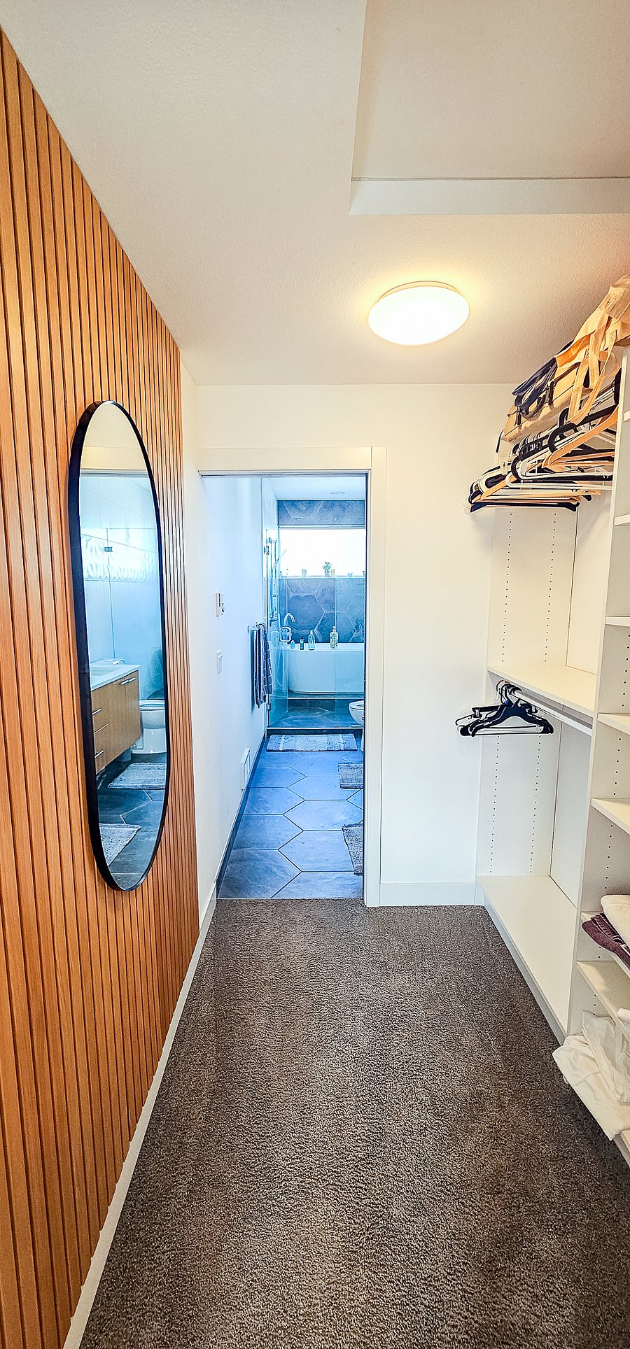 Walkin closet and hall to ensuite bathroom