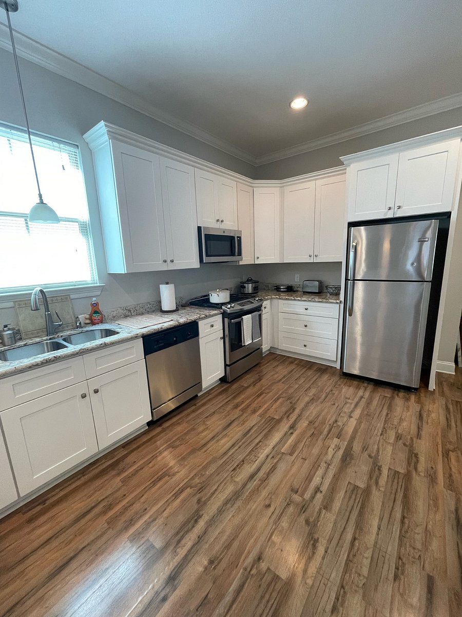 Full kitchen featuring amenities such as a dishwasher, oven, stove, microwave, refrigerator and freezer, toaster, coffee machine, crockpot, and waffle-maker.