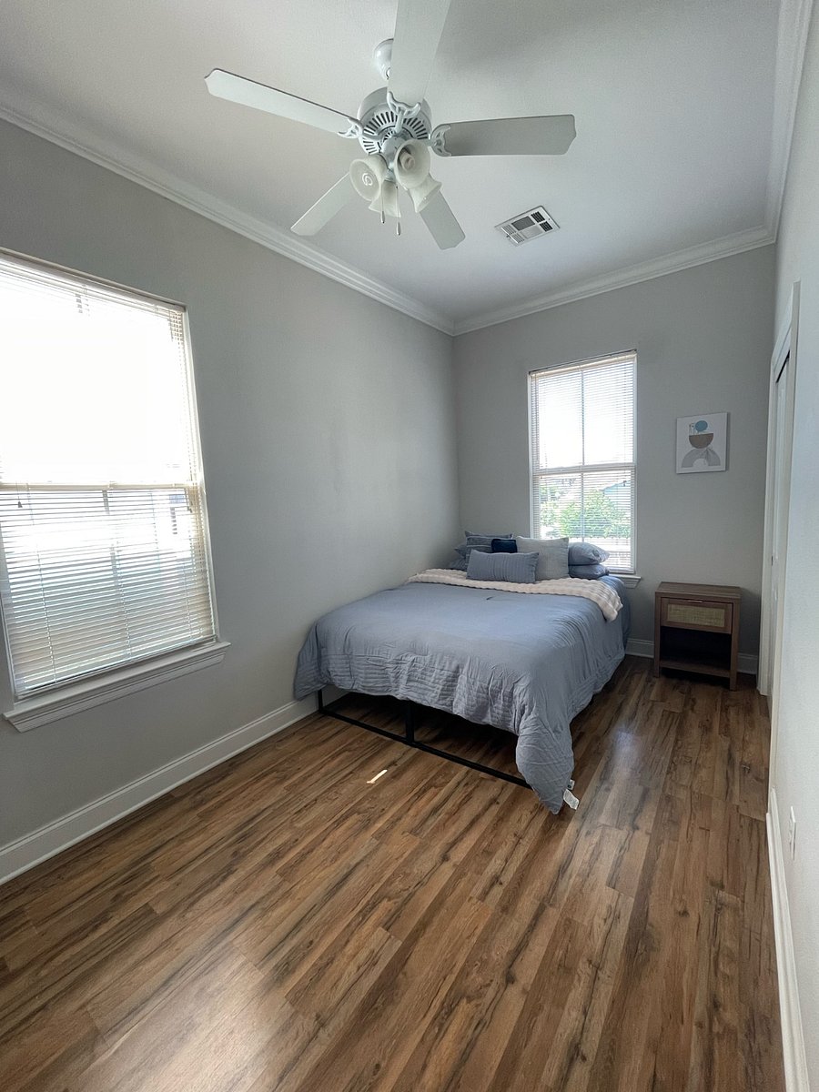 Second bedroom. This bedroom features a Queen Bed, nightstand with a night lamp, a 5-drawer dresser, and closet space.