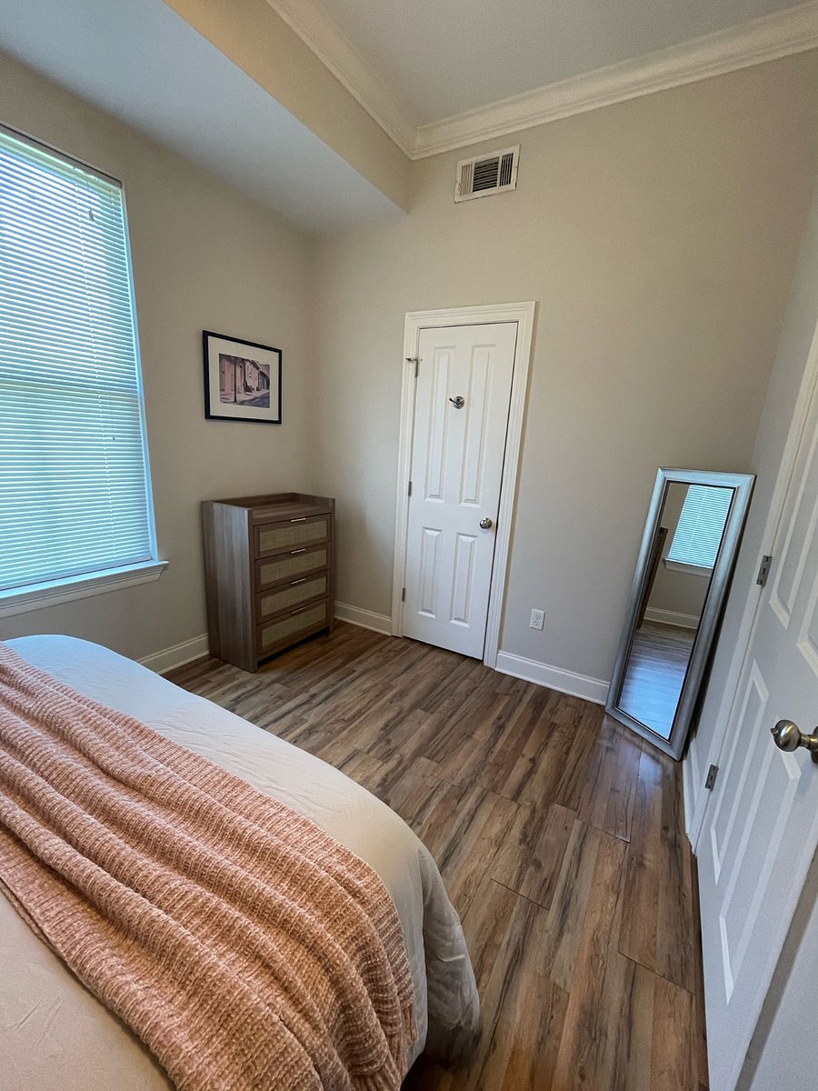 The door next to the dresser leads into the main bathroom. The dressing mirror is also available in the front bedroom.
