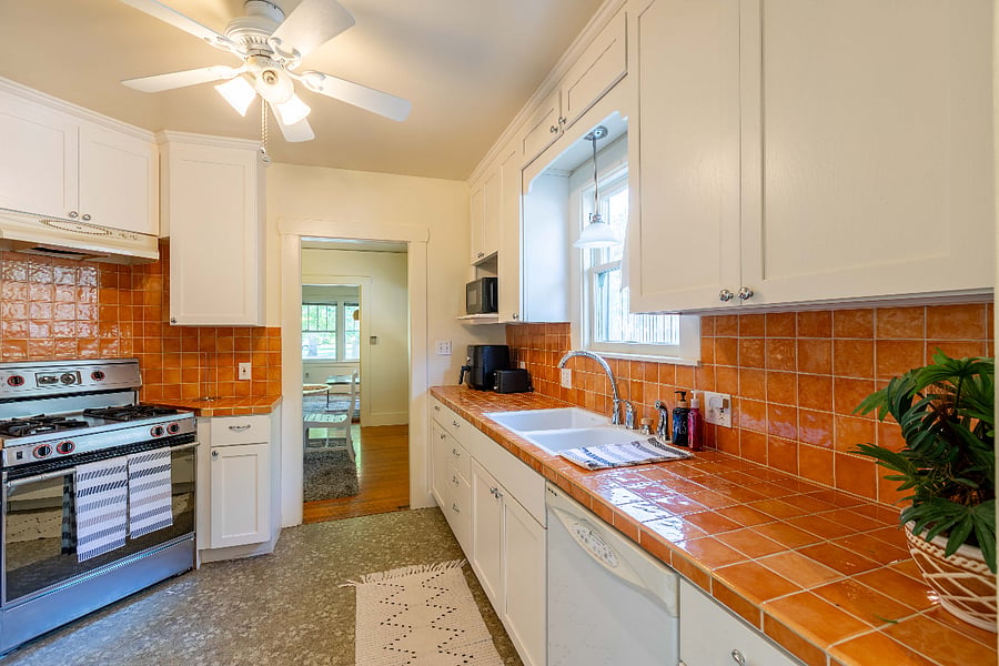 Kitchen with full appliances and refrigerator