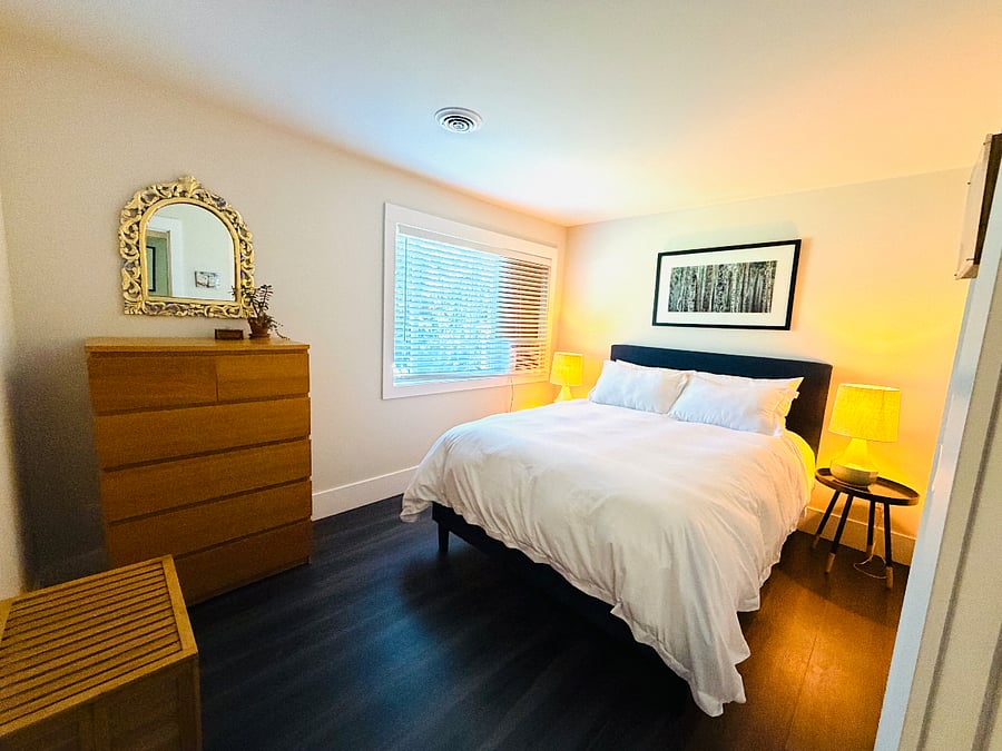 Bedroom 1 with window ac unit during summer months