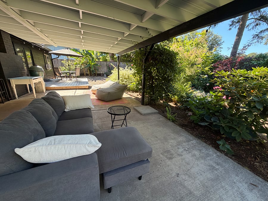 Back patio with BBQ, sofa & oversized bean bag chairs