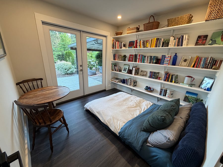 Reading room/bedroom 3 with French doors to back patio (bed pulled out).