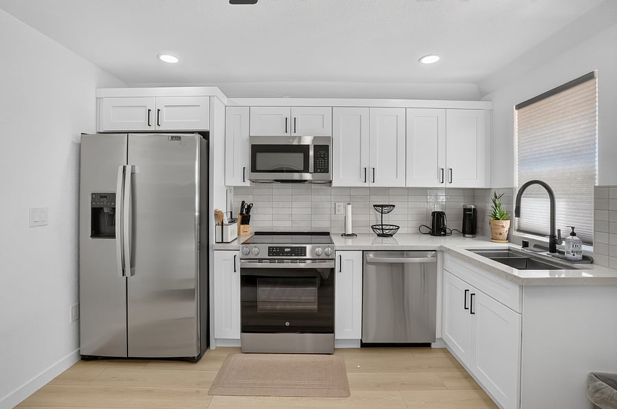 Full size kitchen with stainless steel appliances 