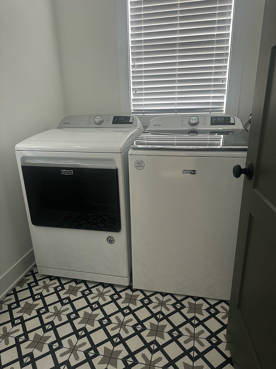There is a full size washer and dryer on the bedroom level of the house at the end of the hall.