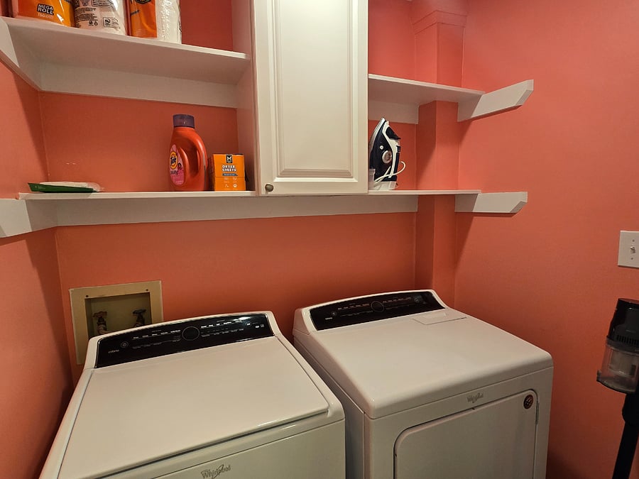 Laundry in hallway between bedrooms