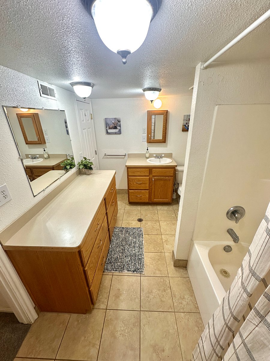 Shared bathroom with full shower and tub. 