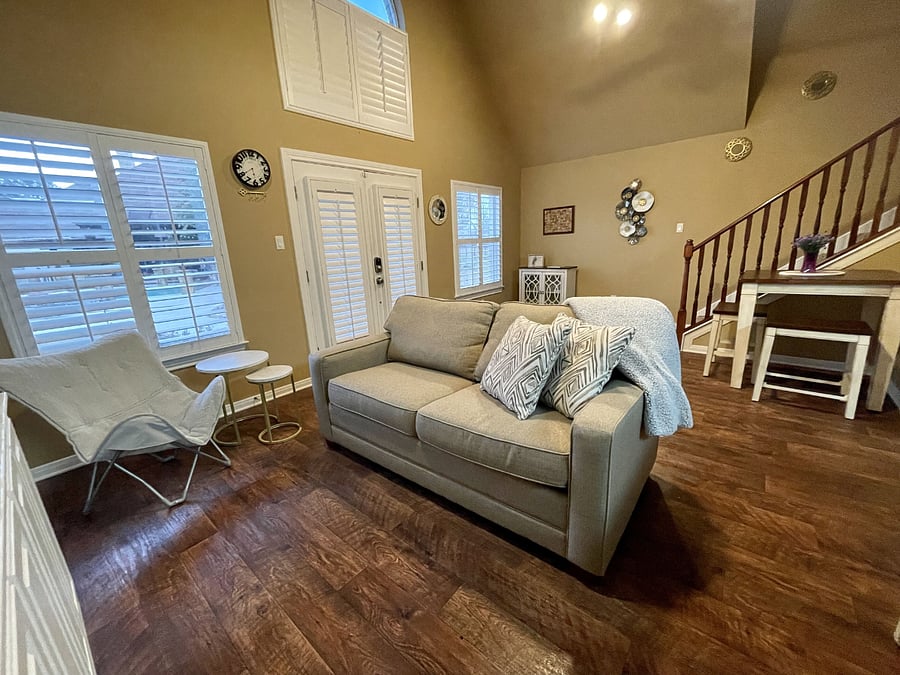 Living Room, showing the front door and stairs going up