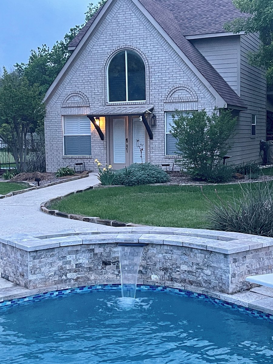 Pool Waterfall with the Cottage