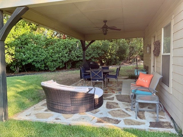 Private Cottage Patio with a table, seating, and grill