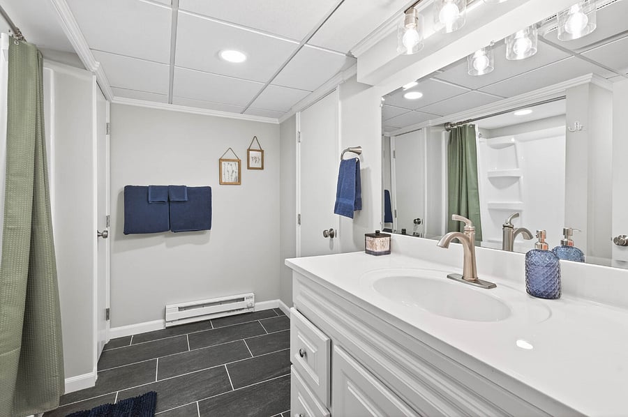 Basement bathroom with full shower.