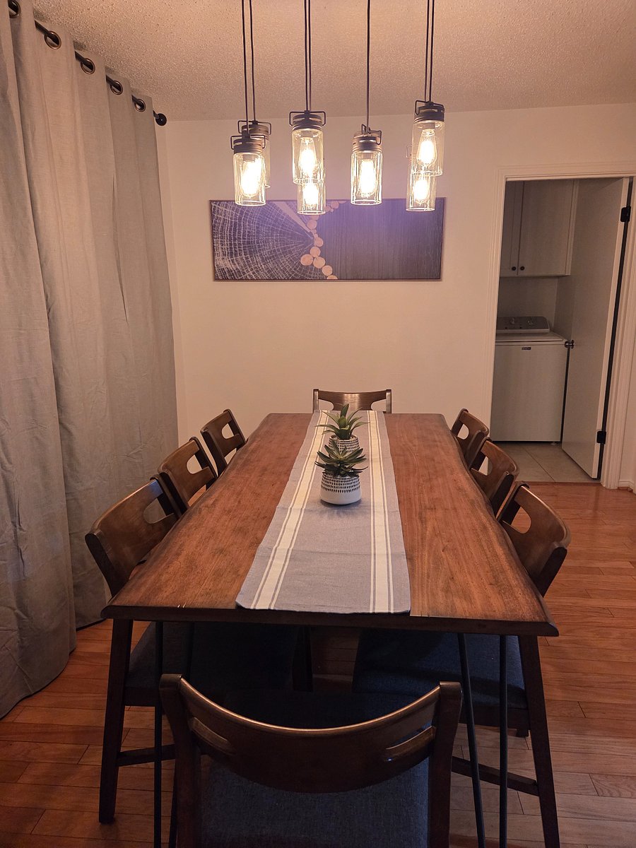 Large dining table with laundry room and pantry.