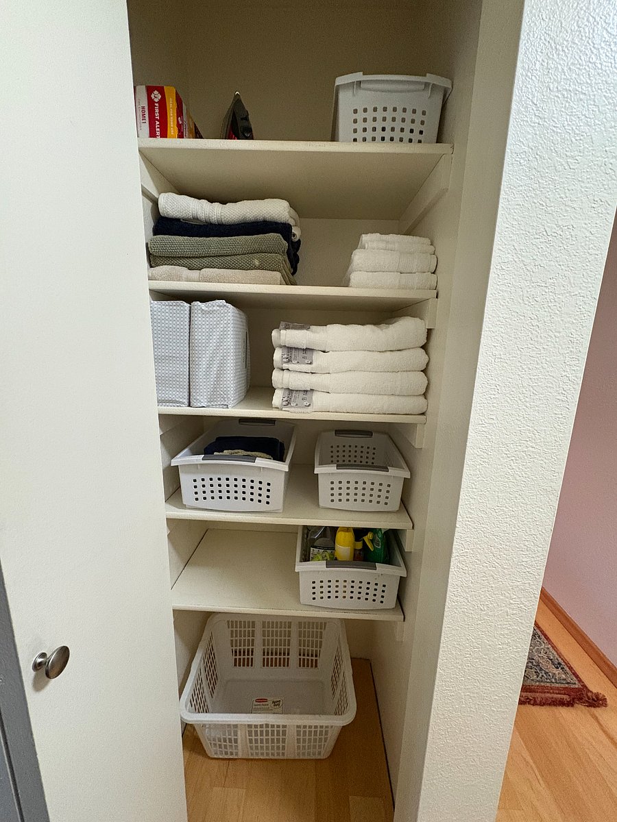 Hall Closetcomes stocked with unused towels and sheets as well as spares and used extras for any happy little accidents. There is also a basket of cleaning supplies and an iron.