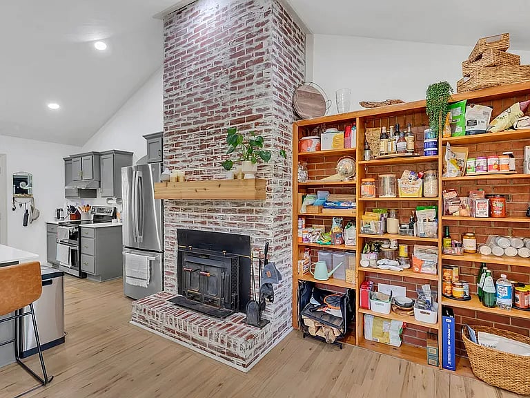 fireplace and pantry in kitchen
