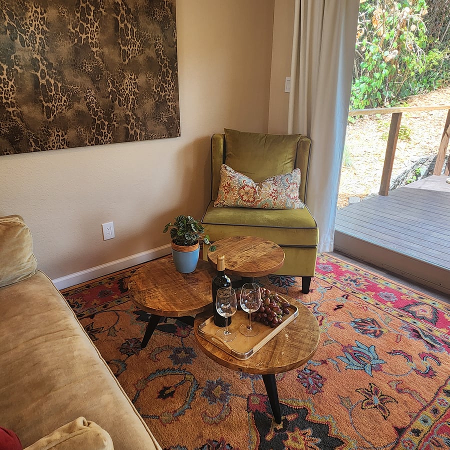 Comfortable living area with viewing of the wall mounted television and the private deck