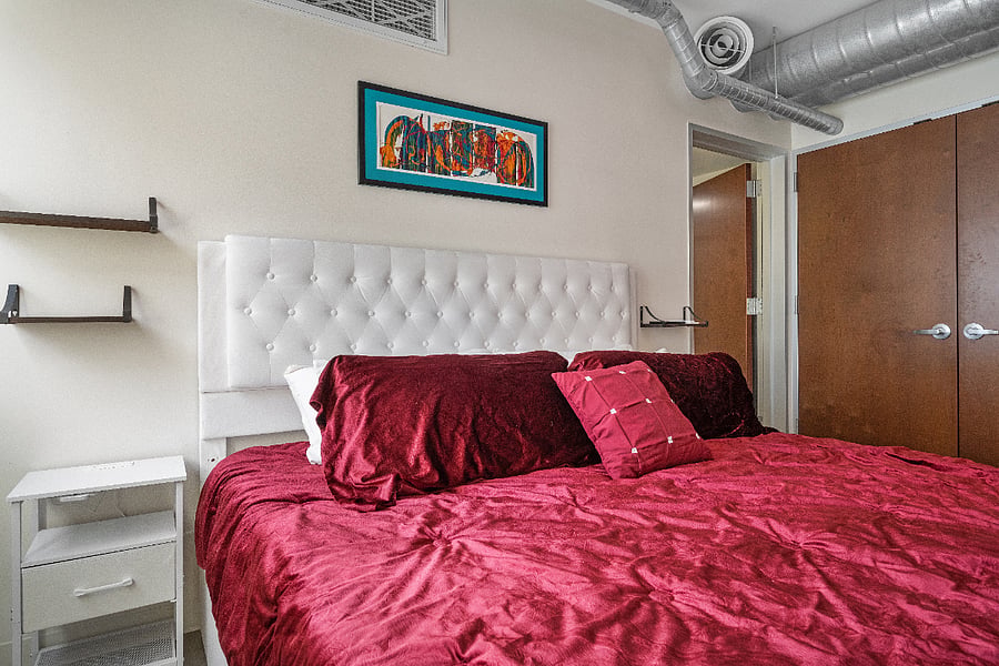 King Bed with plugs on both sides.