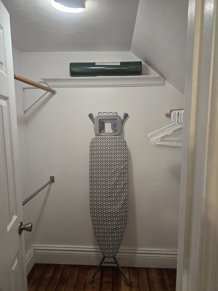 Walk in closet with lots of area for hanging clothes.