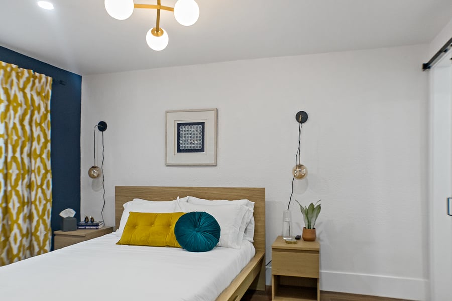 Relax and unwind in this cozy bedroom designed for comfort. It features a Queen-sized bed with crisp linens, tasteful decor, and ample storage space for your clothes to ensure a peaceful night's sleep.