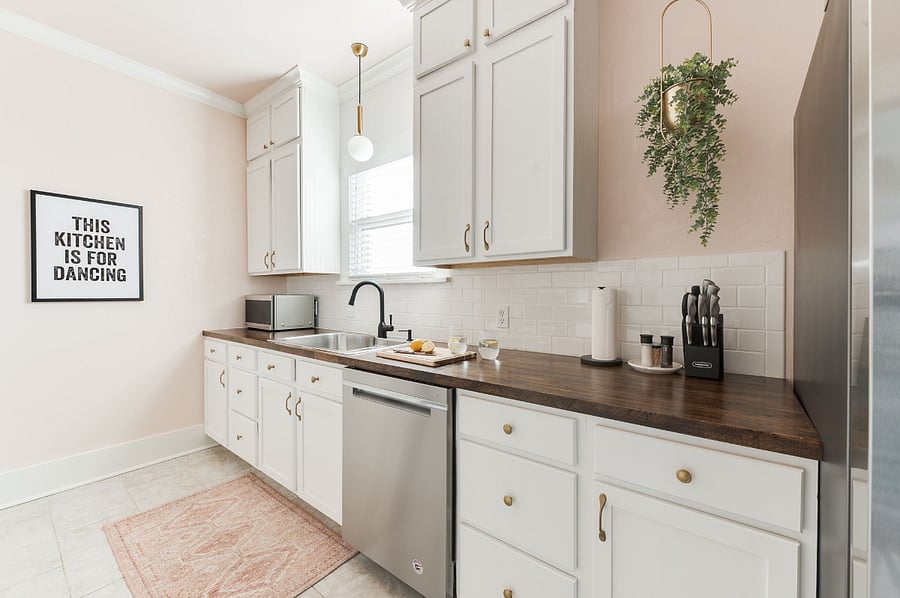 Airy, fully stocked kitchen - complete with all the 4-burner gas stove, fridge with ice & water, pots, pans, knives, cooking utensils, coffee pot, dishes, plates, glassware, wine glasses and all the supplies you will need to make yourself at home!