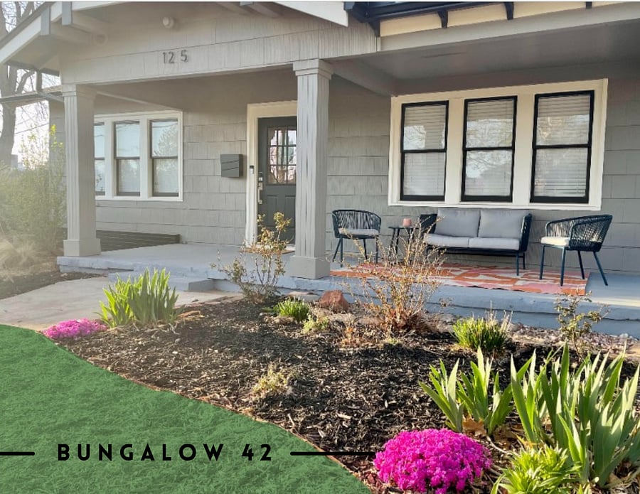 Covered front porch with plenty of seating make the perfect spot to enjoy a coffee and the neighborhood.