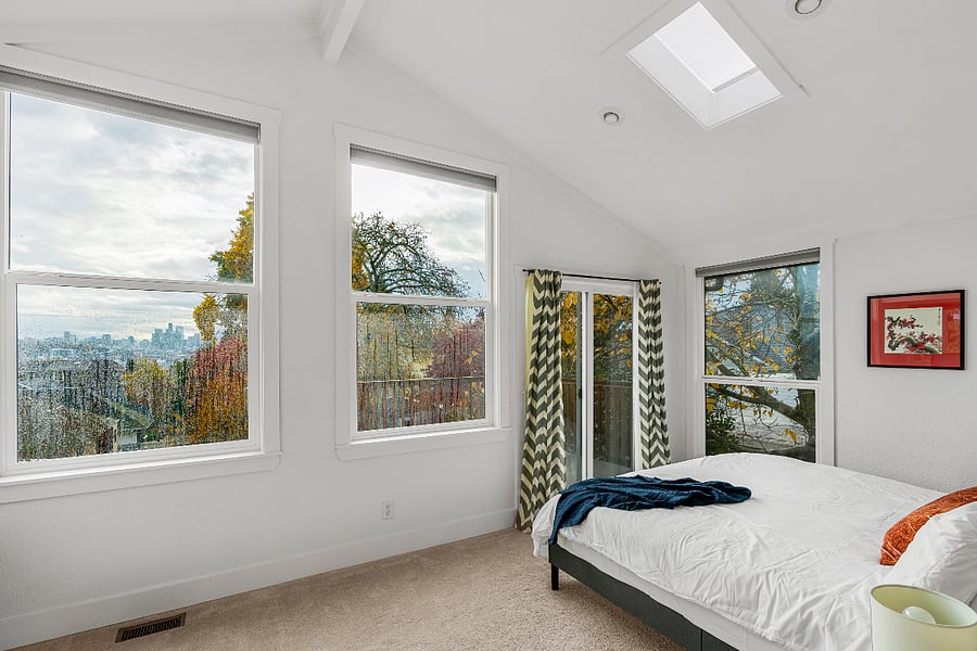 Master bedroom with king bed, private deck, lake views and remote work space