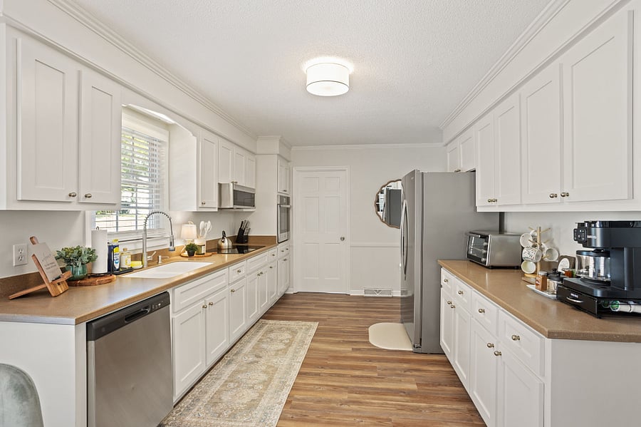 Kitchen includes a cooktop, wall oven, microwave, dishwasher, refrigerator and Keurig Duo Coffee Maker