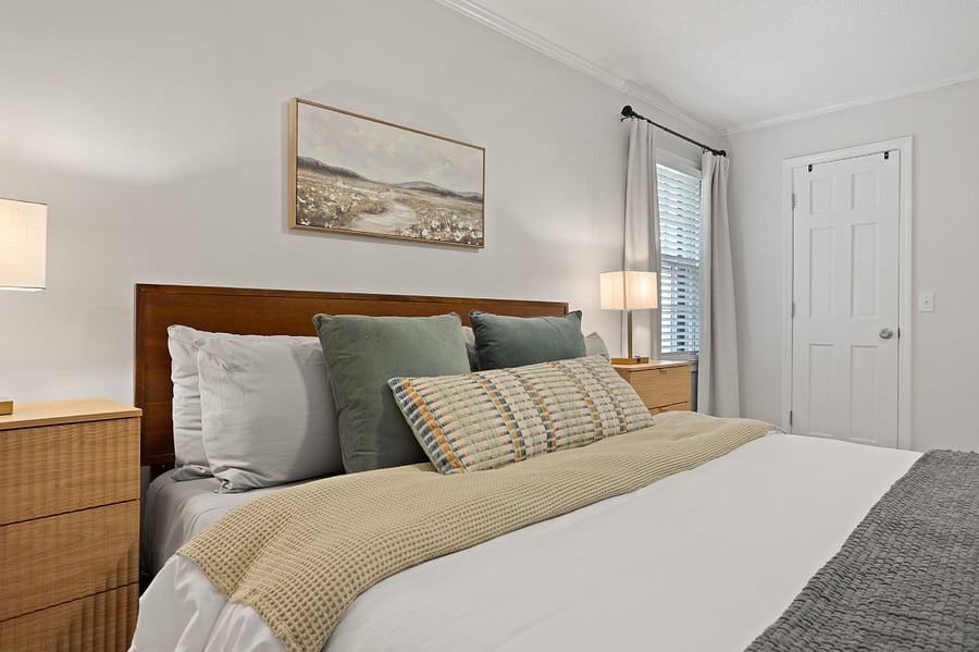 Master Suite with King Bed and lamps with charging ports.