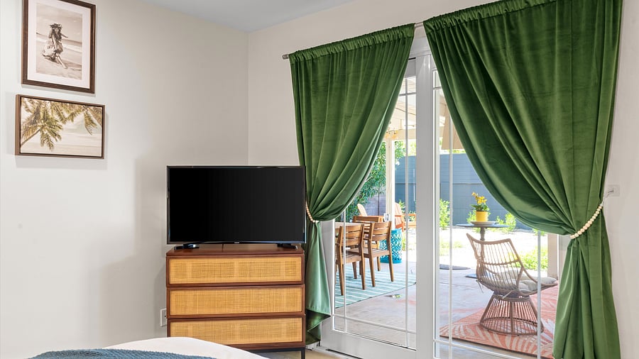 Smart tv and direct access to the covered patio from the ensuite bedroom