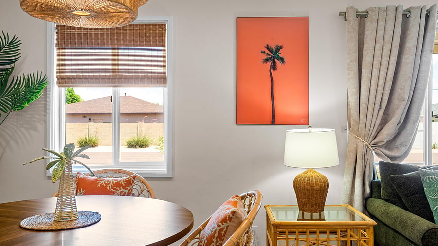 Bright nook with window views and coastal decor- the perfect space for a board game or happy hour drink