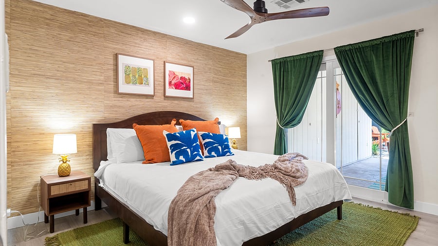 Primary suite with king bed and direct access to the backyard
