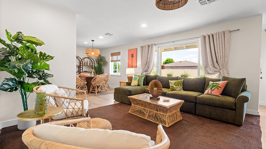 Expansive open living space with woven textures, island decor, and seamless flow to the dining nook