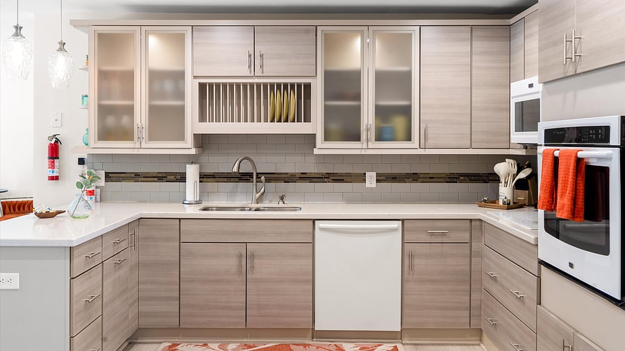 Fully stocked kitchen with soft wood cabinetry, built-in dish rack, and playful details for effortless cooking.