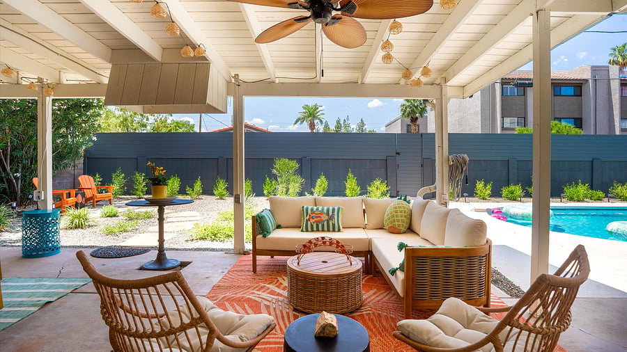 This chic covered patio offers the perfect blend of resort-style comfort and family-friendly charm. Relax, connect, and enjoy poolside moments in total comfort.