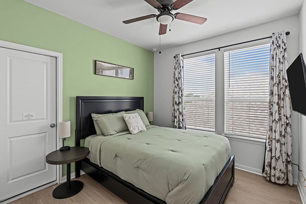 Secondary Bedroom with Queen Size Bed, 50 Roku Smart TV and Blinds with Blackout Curtains.